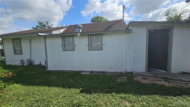 view of property exterior with a yard