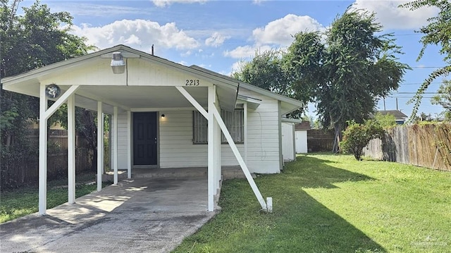 exterior space with a front yard and a carport