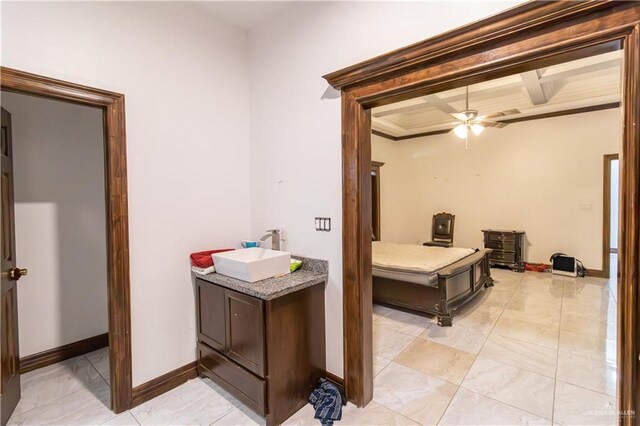 bathroom with beamed ceiling, vanity, ceiling fan, and crown molding