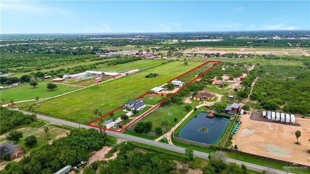 birds eye view of property featuring a rural view