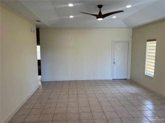 2119 N Ruby St, Edinburg, TX 78541 - empty room with ceiling fan, a raised ceiling, light tile patterned floors, and recessed lighting