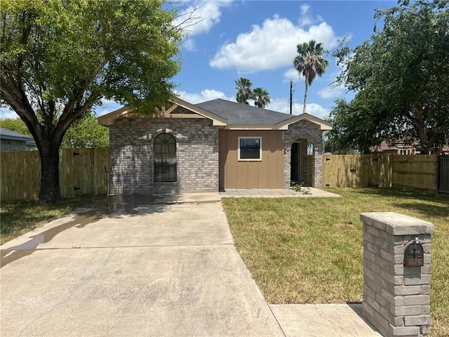 2119 N Ruby St, Edinburg, TX 78541 - single story home featuring board and batten siding, concrete driveway, and brick siding