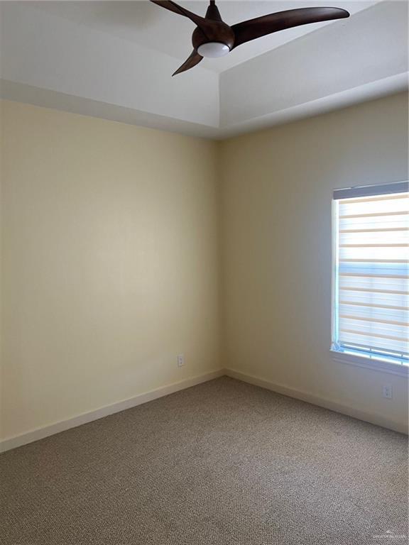 2119 N Ruby St, Edinburg, TX 78541 - unfurnished room featuring ceiling fan and carpet flooring