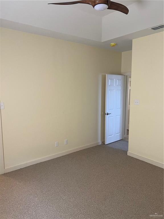 2119 N Ruby St, Edinburg, TX 78541 - carpeted spare room with a ceiling fan and baseboards