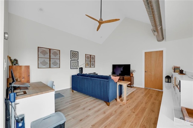 living room featuring a ceiling fan, high vaulted ceiling, and light wood finished floors