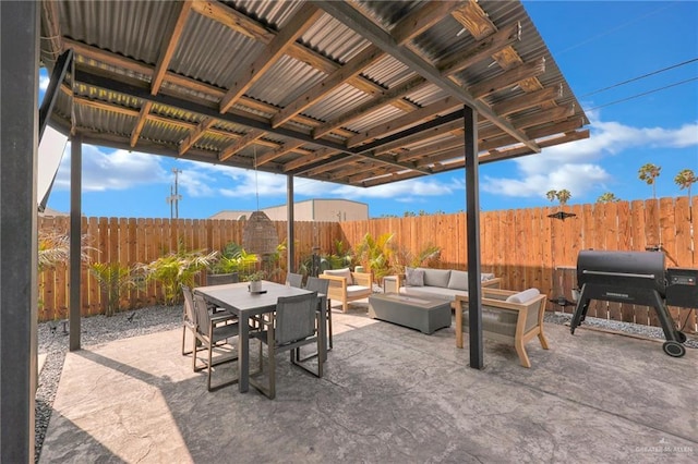 view of patio with a fenced backyard, outdoor dining space, an outdoor living space, and a grill