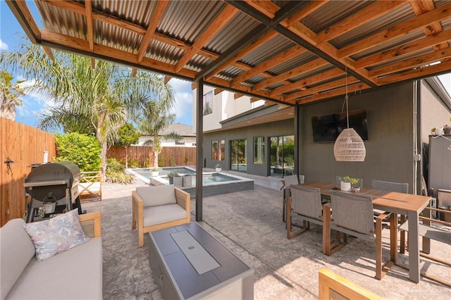 view of patio featuring grilling area, outdoor dining area, a fenced in pool, a fenced backyard, and outdoor lounge area