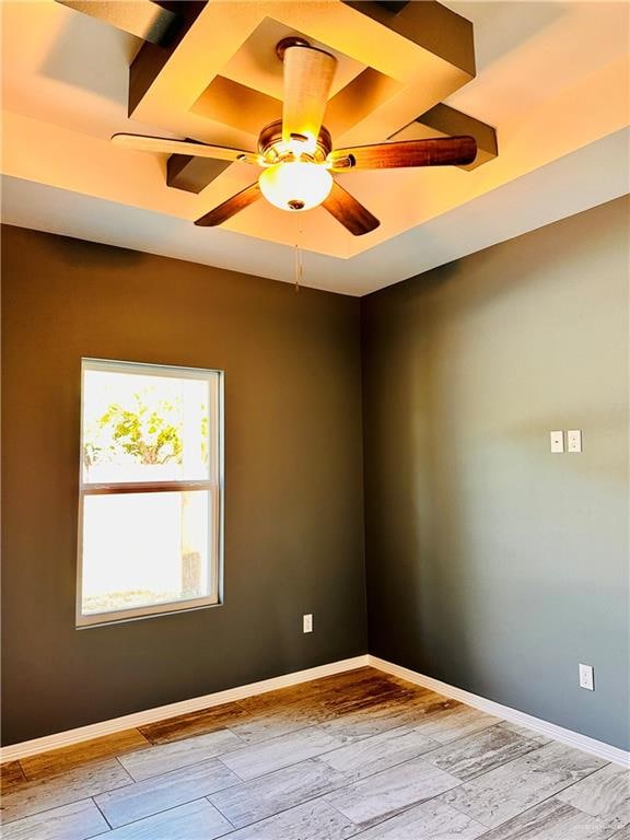 empty room featuring ceiling fan and light hardwood / wood-style floors