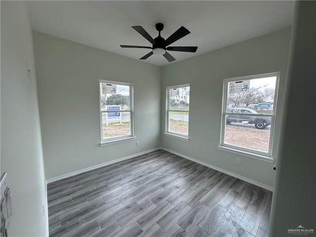 unfurnished room with hardwood / wood-style flooring and ceiling fan