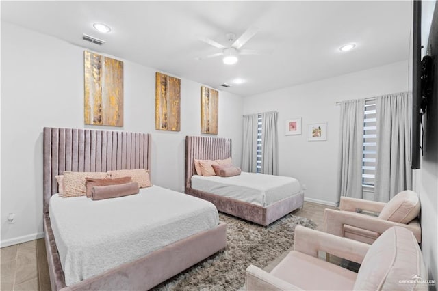 bedroom featuring ceiling fan and light hardwood / wood-style flooring