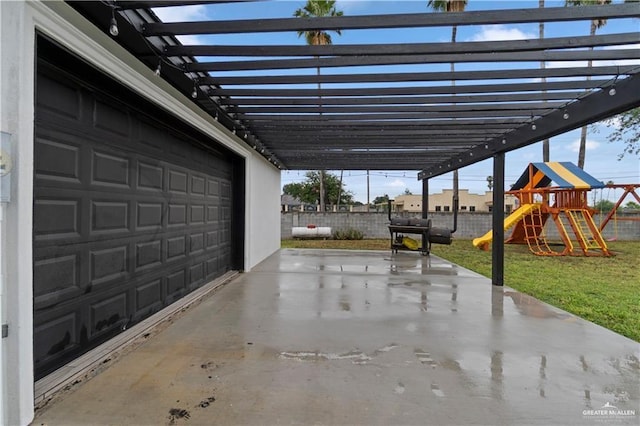 garage featuring a lawn