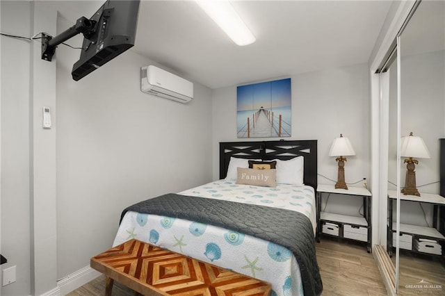 5805 Gulf Blvd, South Padre Island, TX 78597 - bedroom with a wall unit AC and wood finished floors