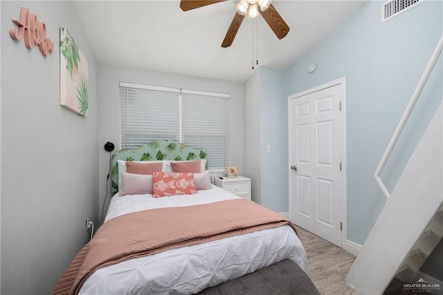 5805 Gulf Blvd, South Padre Island, TX 78597 - bedroom featuring light wood-style flooring and ceiling fan