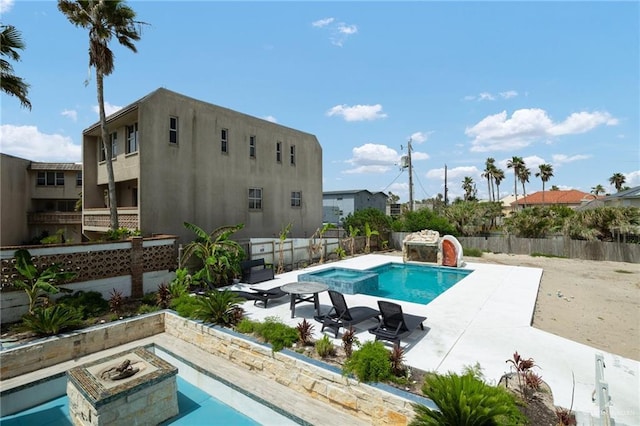 5805 Gulf Blvd, South Padre Island, TX 78597 - view of swimming pool featuring a patio, a fenced backyard, and a pool with connected hot tub