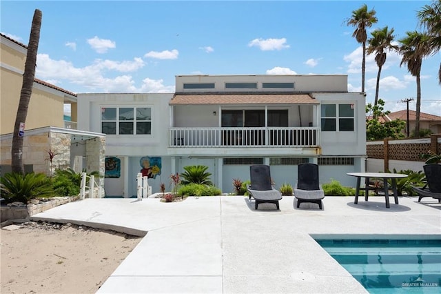5805 Gulf Blvd, South Padre Island, TX 78597 - back of property featuring a patio area, an outdoor pool, and stucco siding