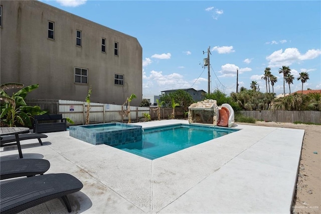 5805 Gulf Blvd, South Padre Island, TX 78597 - view of swimming pool featuring a patio area, a fenced backyard, and a pool with connected hot tub