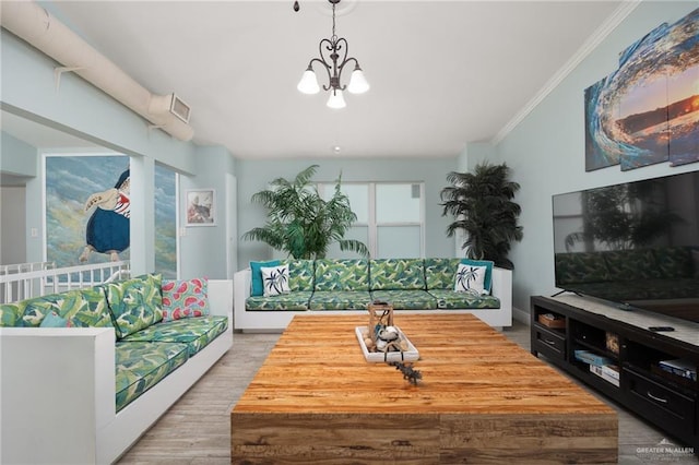 5805 Gulf Blvd, South Padre Island, TX 78597 - living room with a chandelier, crown molding, and wood finished floors