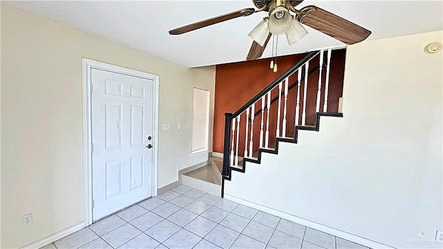 tiled entrance foyer with ceiling fan