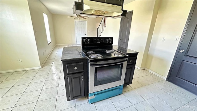 kitchen featuring light tile patterned flooring, ceiling fan, stainless steel range with electric cooktop, and exhaust hood