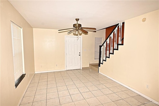 interior space featuring ceiling fan