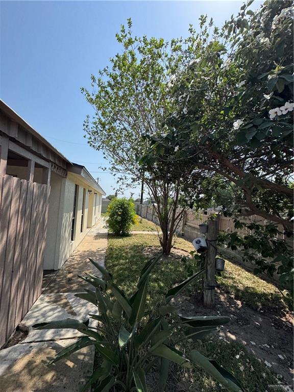 view of yard with a patio and a fenced backyard
