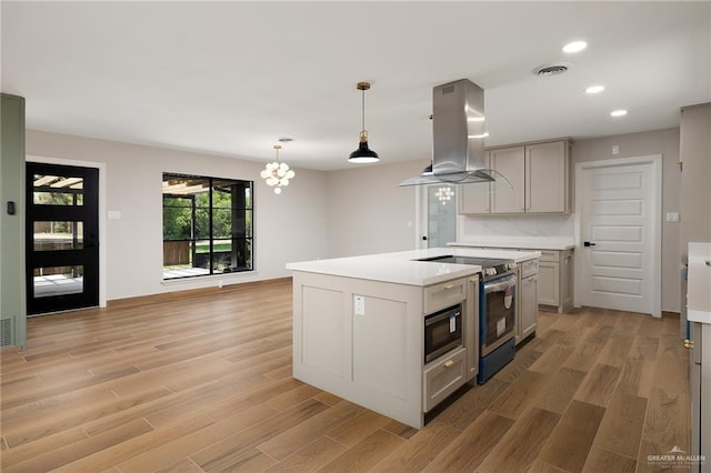 147 W Austin Blvd, Edinburg, TX 78539 - kitchen with electric stove, island exhaust hood, light wood finished floors, and visible vents
