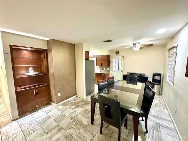 dining space with ceiling fan