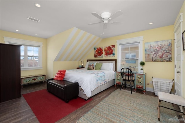 bedroom with dark hardwood / wood-style floors, ceiling fan, and lofted ceiling