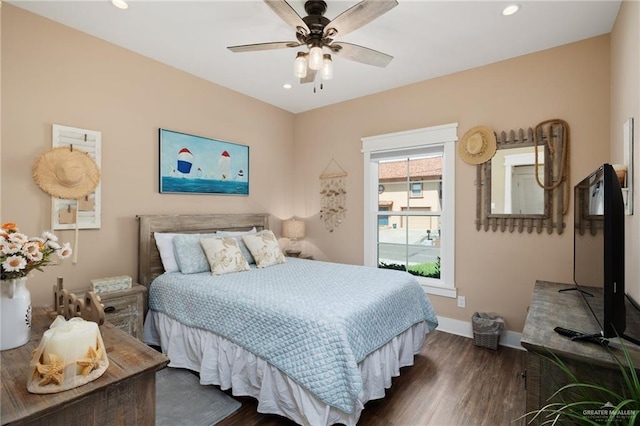 bedroom featuring ceiling fan and dark hardwood / wood-style floors