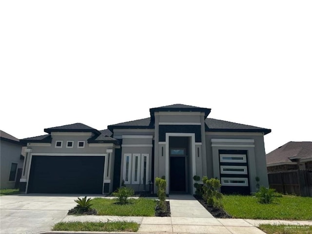 prairie-style home featuring a garage