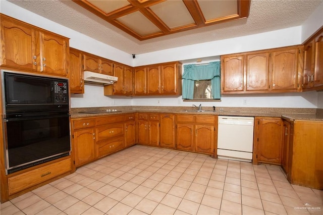 kitchen featuring black appliances, a textured ceiling, and sink