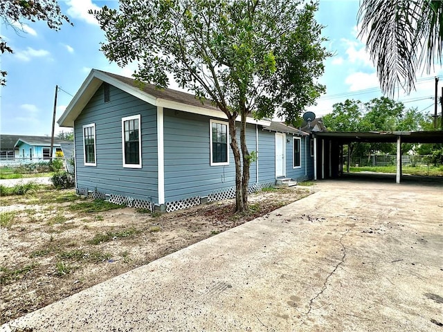 view of front of property with a carport