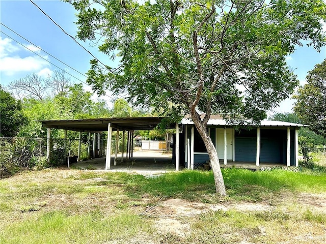 exterior space featuring a carport