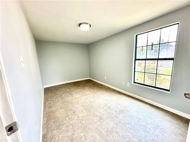 empty room featuring carpet flooring