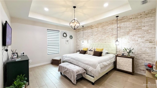 2800 Encke Rd, Mission, TX 78574 - bedroom with brick wall, a raised ceiling, light wood finished floors, and recessed lighting