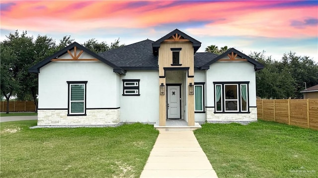 2800 Encke Rd, Mission, TX 78574 - view of front facade featuring stone siding, a shingled roof, and stucco siding