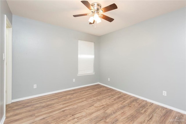 unfurnished room featuring light wood-type flooring and ceiling fan