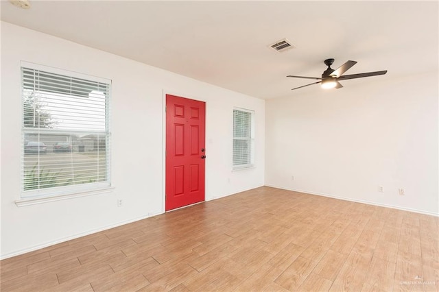 spare room with light hardwood / wood-style flooring and ceiling fan