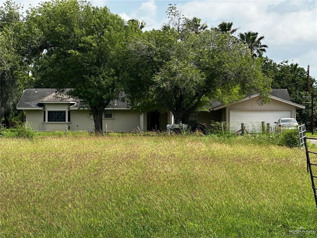 view of yard featuring a garage