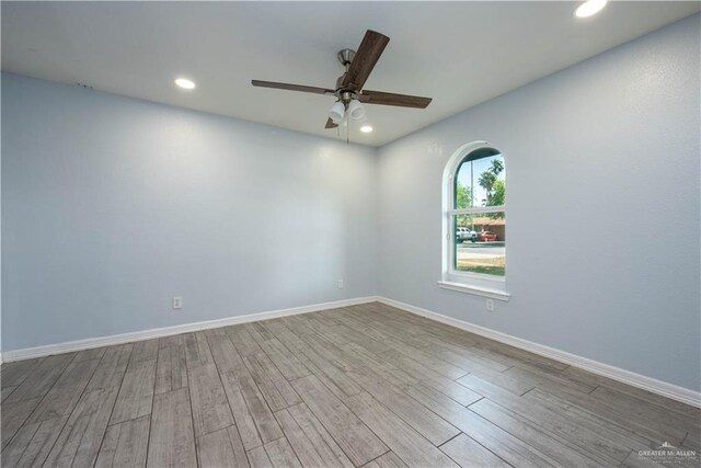 bedroom featuring light hardwood / wood-style floors and ceiling fan