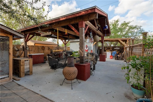 view of patio with a storage unit