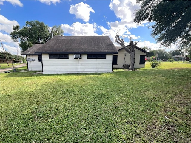 view of side of property featuring a yard