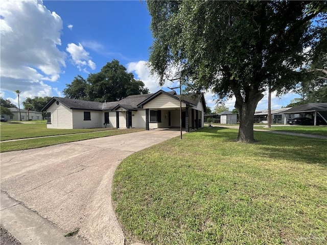 ranch-style house featuring a front yard and a carport