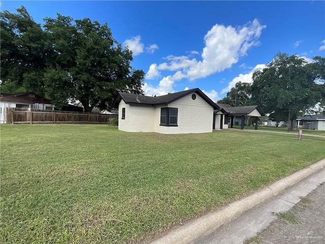 view of property exterior with a lawn