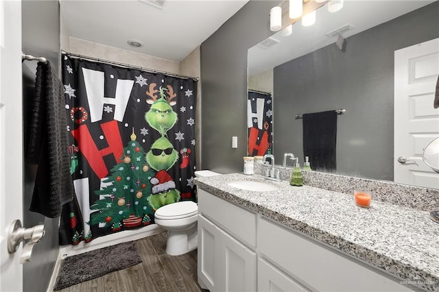 14205 Sweet Water Way, Mcallen, TX 78504 - bathroom with vanity, wood finished floors, toilet, and a shower with shower curtain