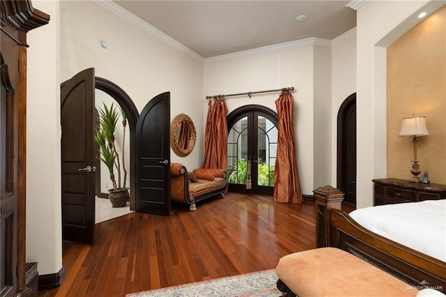 bedroom featuring french doors, dark hardwood / wood-style floors, and ornamental molding