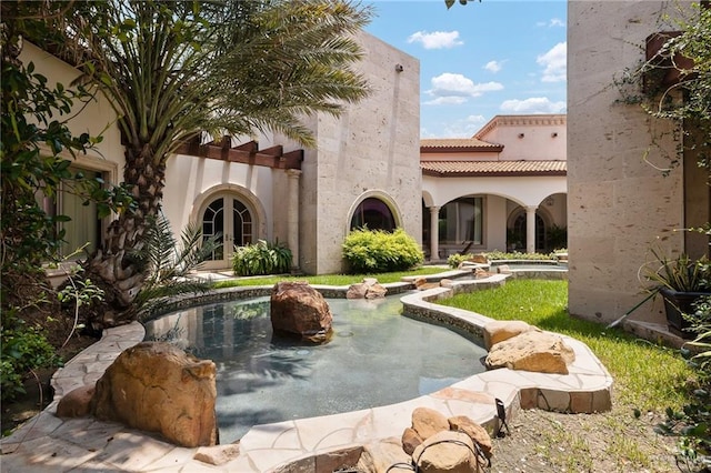 back of property with french doors