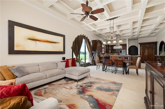 living room with ceiling fan with notable chandelier, beam ceiling, and coffered ceiling