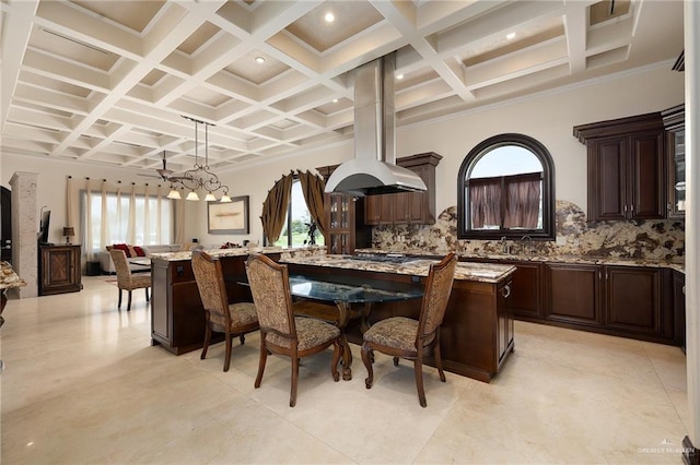 dining room with beamed ceiling, ornamental molding, and coffered ceiling