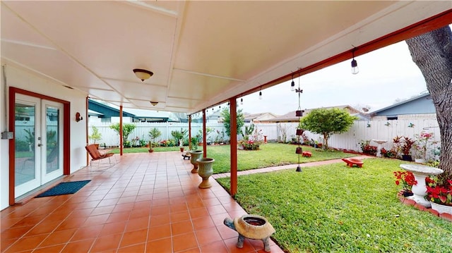 view of patio featuring a fenced backyard and french doors